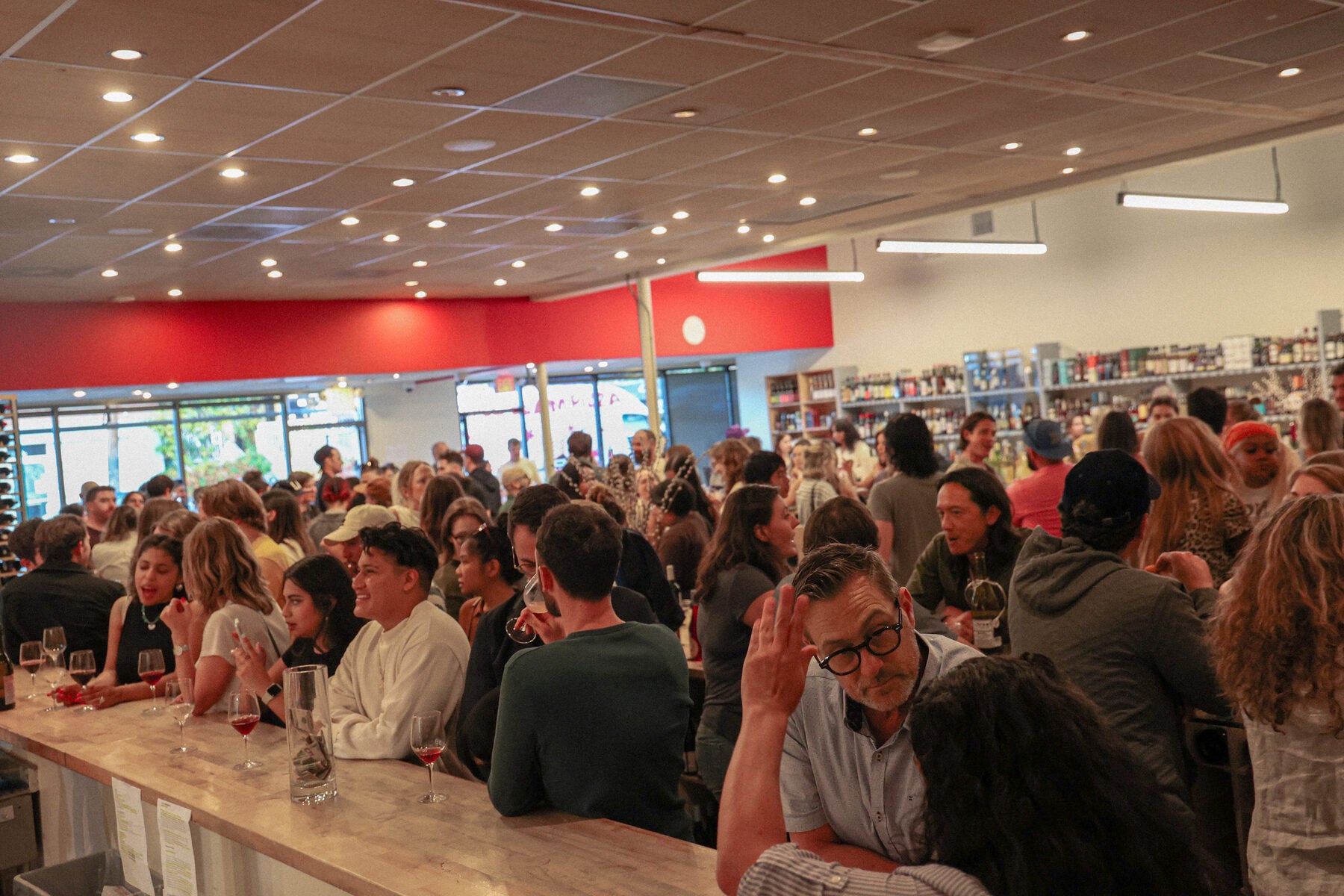 The bar at sunset with a full crowd