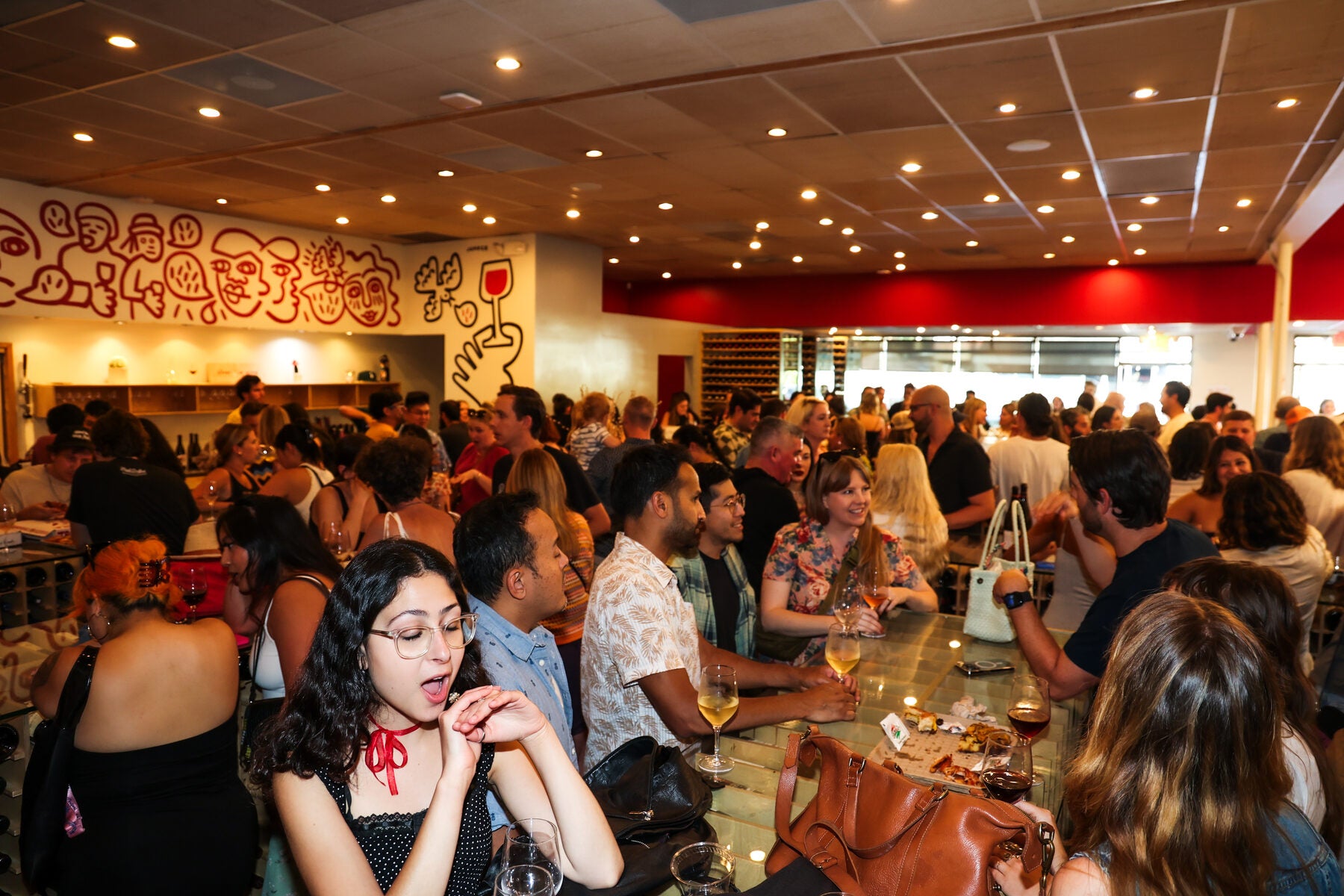 A crowd of friends gathered inside Silver Lake Wine